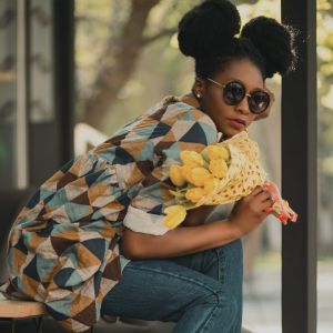 Stylish woman with yellow tulips, before departure