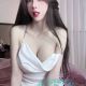 Attractive Chinese woman in a white top.