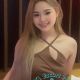 Aiza, a Malaysia escort model, in a brown dress.
