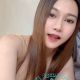 Attractive young woman with braces, offering escort services.