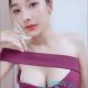 Attractive woman in a burgundy off-the-shoulder dress. Local escort.