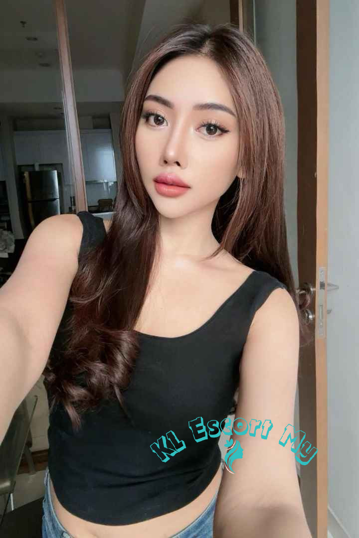 Attractive young woman in black top, KL Escort My
