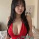 Bethany, a part-time escort in KL, Malaysia, in a red outfit.