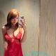 Woman in red lingerie taking a selfie. Malaysia sex escort services.