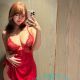 Woman in red lingerie taking a selfie