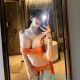 Attractive Korea escort in Kuala Lumpur, wearing an orange bikini.
