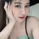 Attractive young woman in a black top. Best escort girl services.