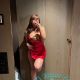 Woman in red dress taking a selfie. Malaysia sex escort services.