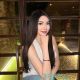 Aimi, a Malay girl, in a white top and jeans. Malaysia escort service.
