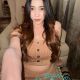 Attractive woman in a beige outfit. Incall and outcall escort services.