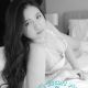 Attractive KL escort, Marissa, in a white top.