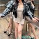 Shazana, KL Escort Outcall, in stylish dress and leather jacket.