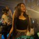 Attractive Malay woman in a nightclub setting.