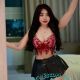 Shazana, KL Escort Outcall, in a red top and black skirt.