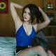 Attractive Malay woman in blue top and shorts