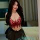 Shazana, KL escort outcall offering sex services. Attractive woman in red top and black skirt.