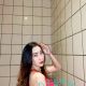 Attractive woman in red dress. Incall and outcall escort services available.