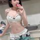 Attractive young woman in lingerie, enjoying a popsicle. KL Escort Agency.