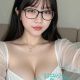Attractive young woman wearing glasses and a white bra. Malaysia escort.