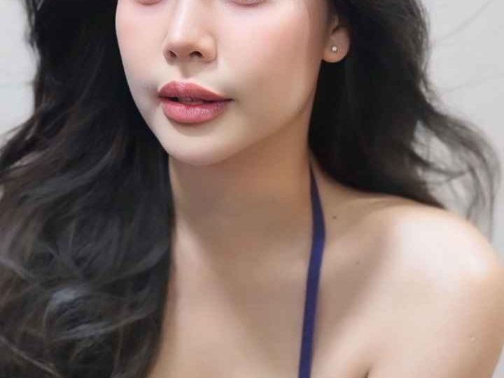 Attractive young woman in a purple lace bra. KL Escort My.