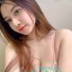 Attractive young woman in pink lingerie. Best escort girl services.
