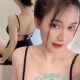 Attractive woman in black top, offering escort girl services.
