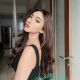 Aimi, a Malay girl, in a black top and jeans. Malaysia escort service.