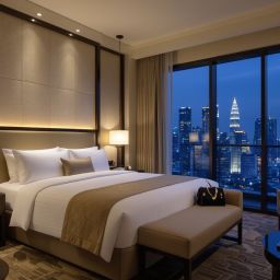 Luxury hotel room in Kuala Lumpur with a city view, featuring a comfortable bed and a modern design.
